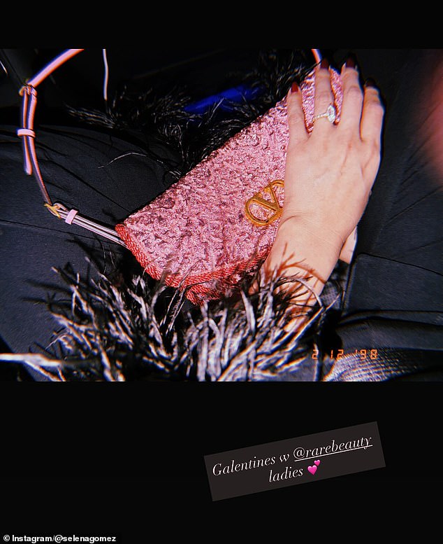 She snapped a picture while donning her stylish pajamas and held a pink Valentino purse alongside the text: 'Galentines w @rarebeauty ladies'